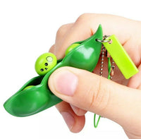 
              Pea Poppers Pea Pod Squeeze A Bean Silent Fidget Sensory Toy Keyring
            